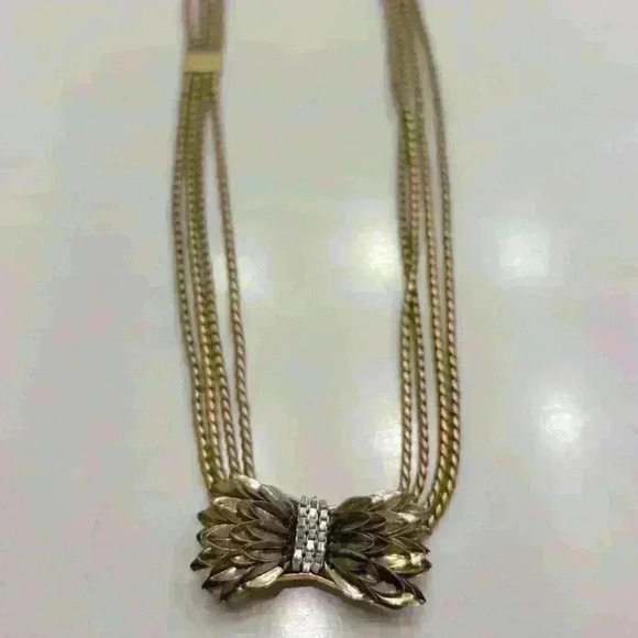 Stella & Dot Jewelry - Stella and Daughter gold bow necklace with rhinestones.